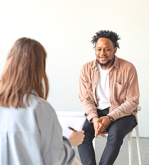 Man sitting across from a therapist