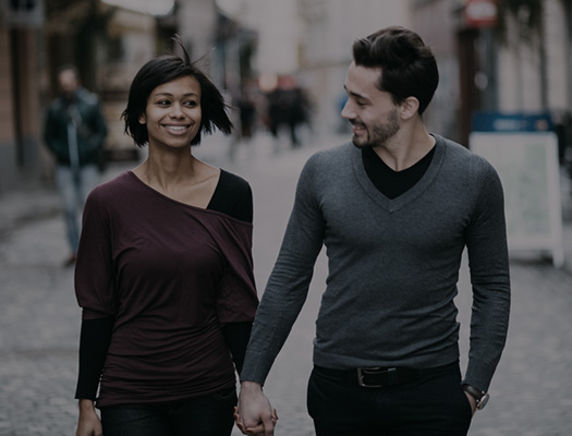 Couple walking down street