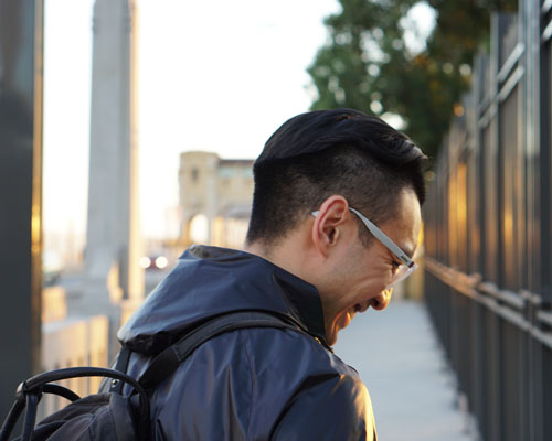 Gabe walking with backpack