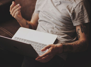 man sitting with laptop