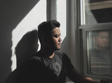 Man sitting by window