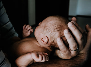 Man holding baby